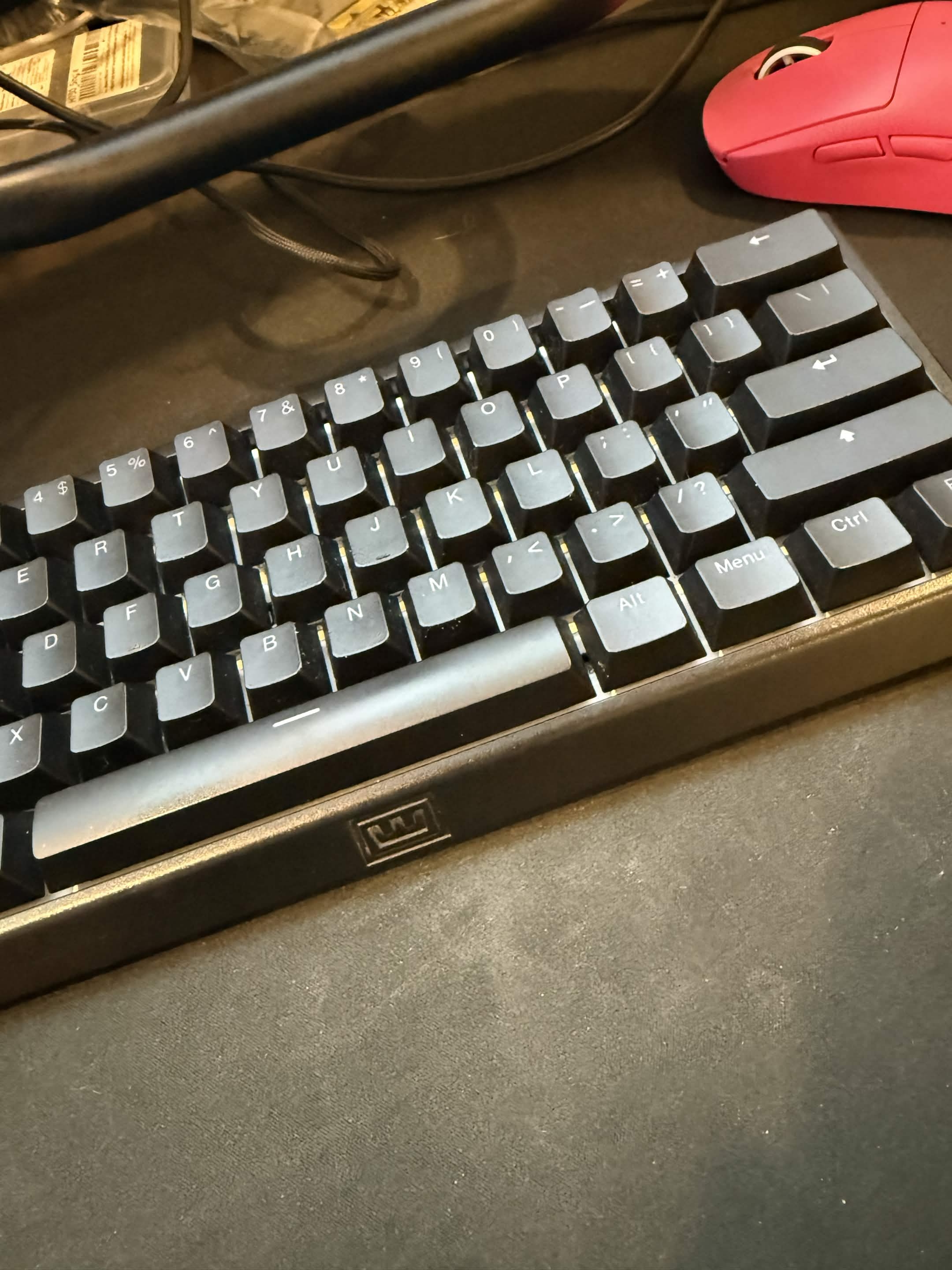 Wooting 60HE+ keyboard on desk during testing